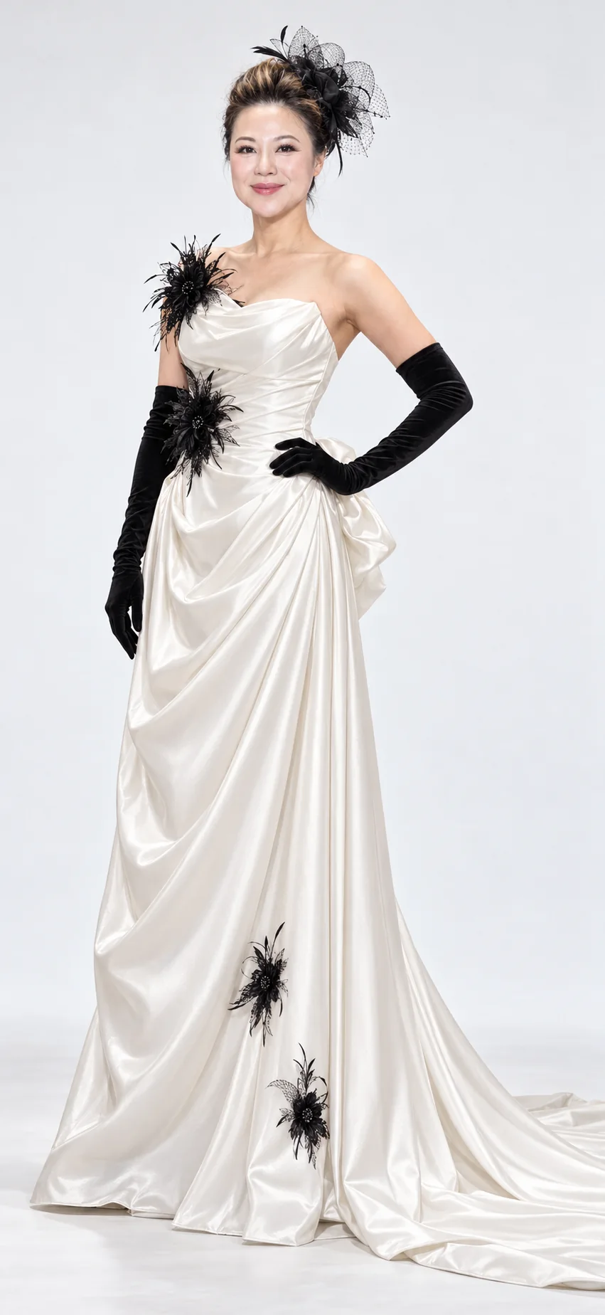 Sue Wang in an ivory gown with black floral details